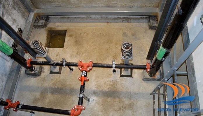 Bộ giảm chấn buffer đặt tại đáy hố pít thang máy giúp hấp thụ lực tác động